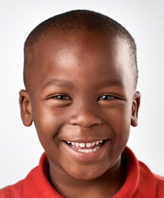 Happy young boy benefiting from HealthyStart oral appliances